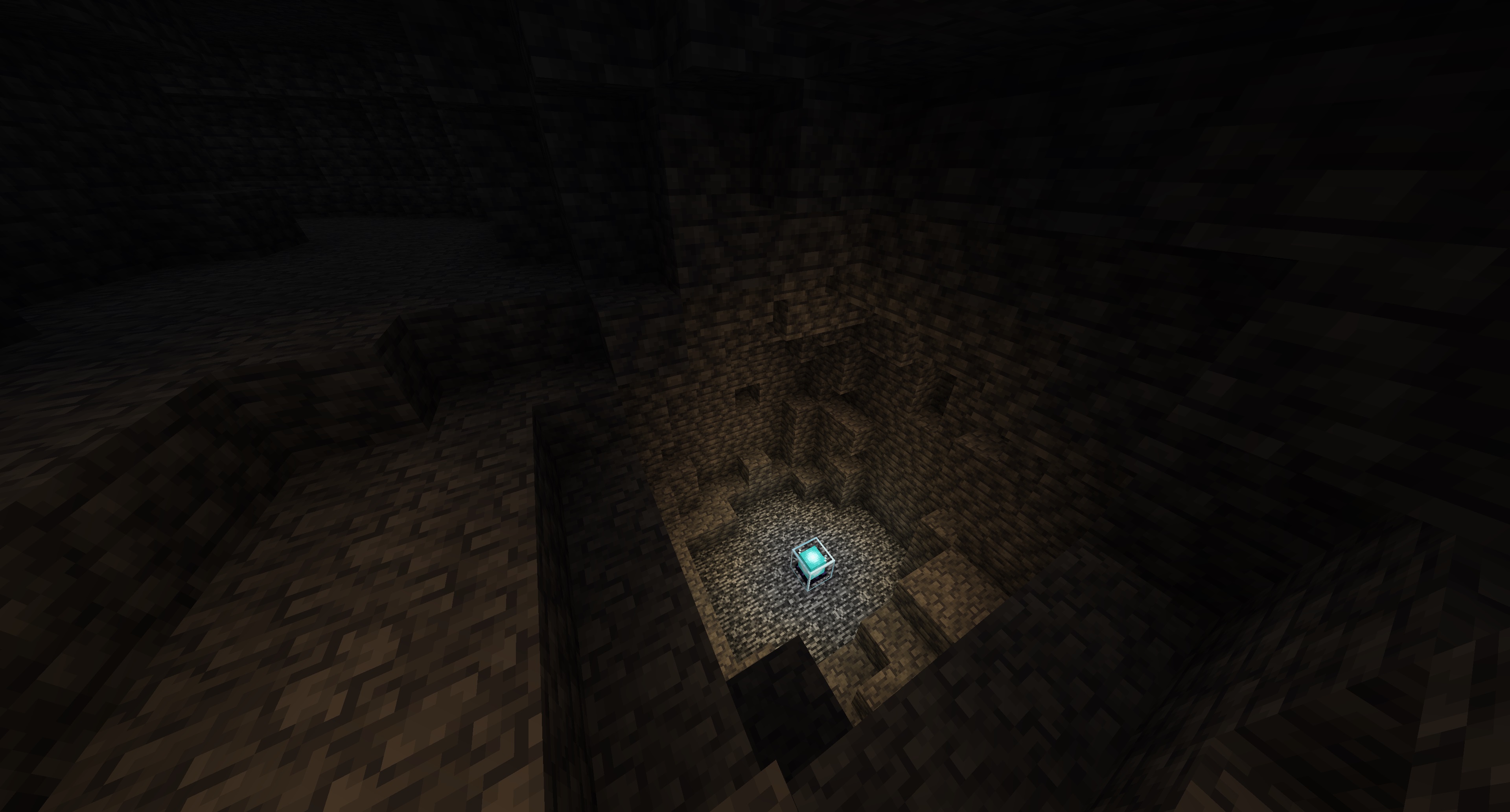 A glowing node controller block placed on the bedrock layer deep underground